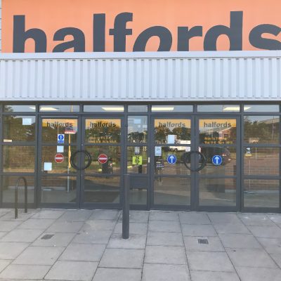 Halfords doors and entrance painted by Kolorbond.